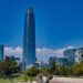 Skyline of Santiago, Chile, featuring the modern Gran Torre Santiago skyscraper against the backdrop of the Andes Mountains.