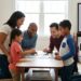 A happy, diverse family playing a board game together in a cozy living room, illustrating which parenting style is most encouraged in modern america?—Authoritative Parenting.